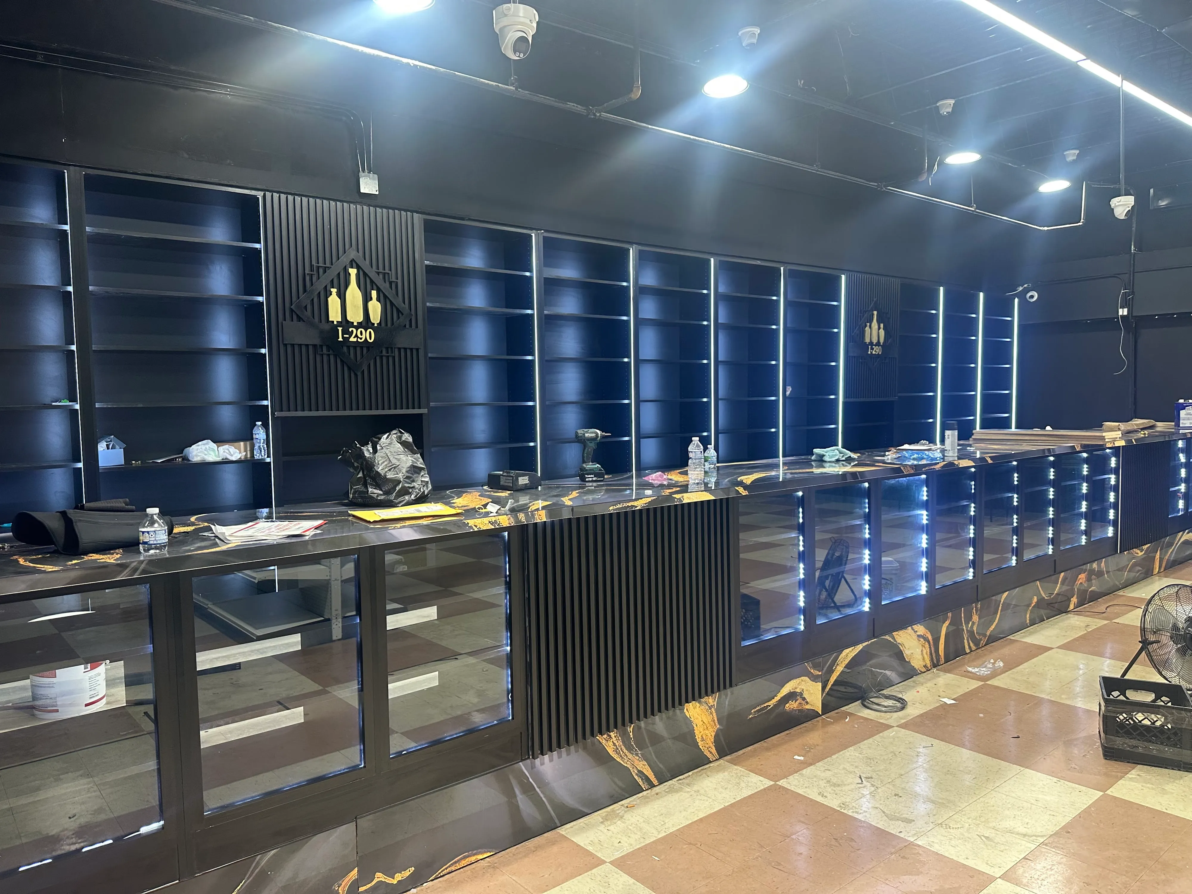 Backlit custom retail casework with marble countertop