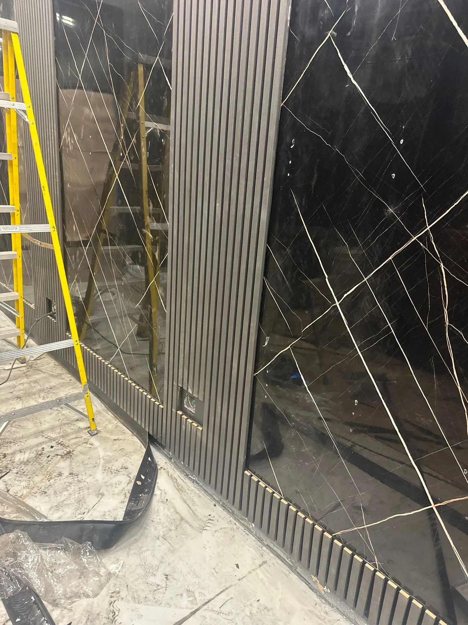 Interior glass and stone paneling in a commercial fit-out