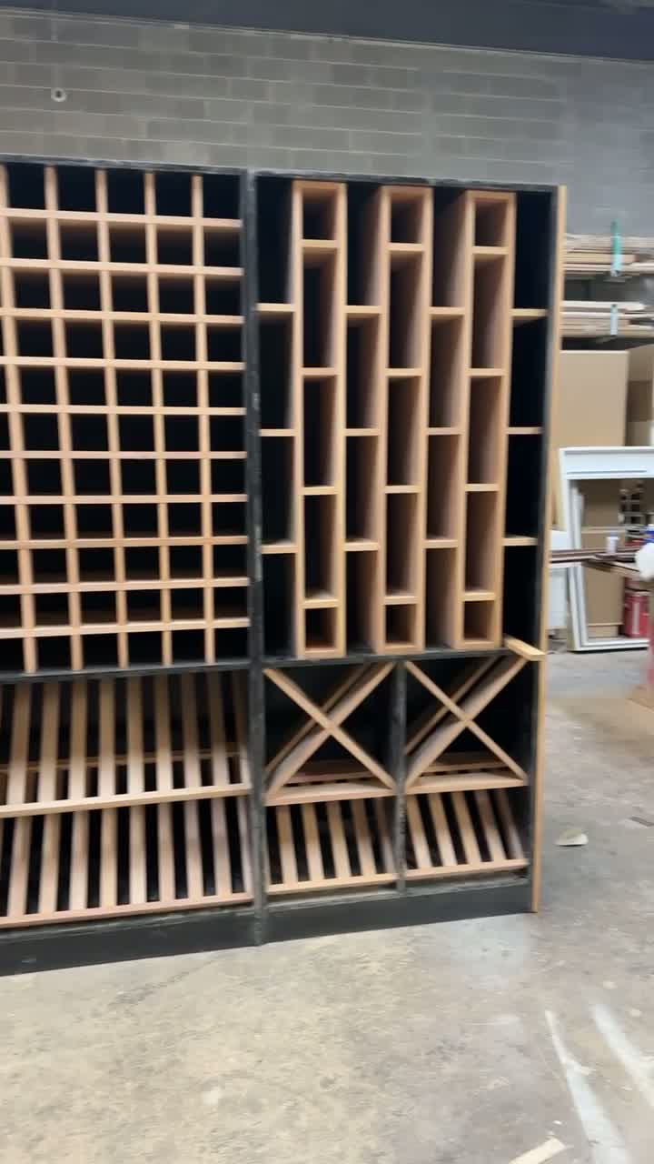 Custom wood cabinetry and wine-rack shelving construction