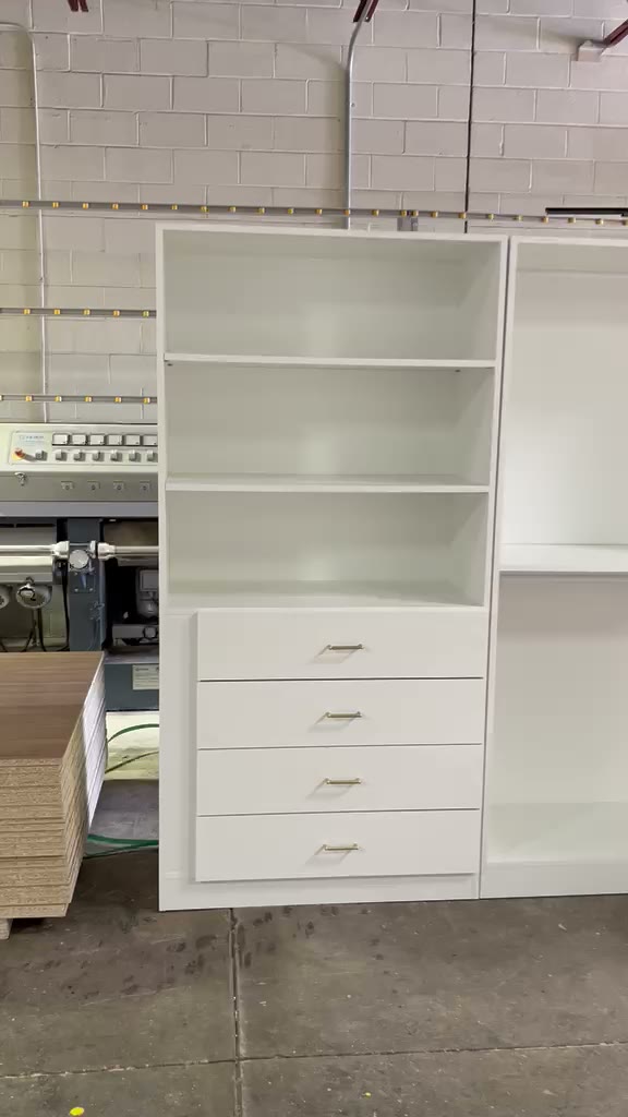 Custom closet cabinetry build with wood-grain interior paneling